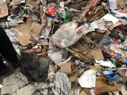 Pile of paper and card contaminated with plastic