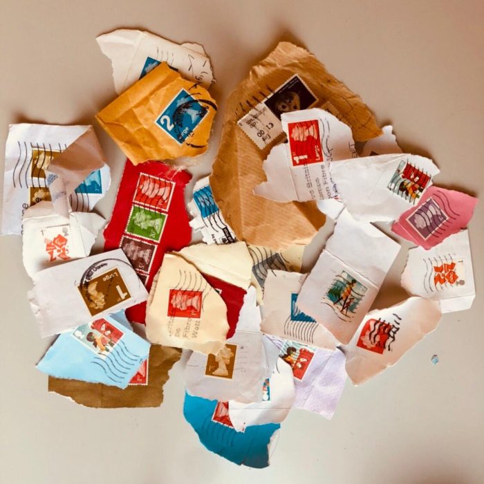 Pile of used postage stamps