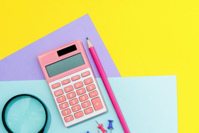 image of mathematic supplies, including calculator, pencil and papers
