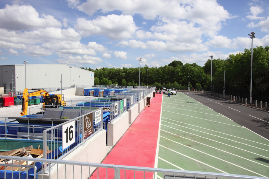 Longley lane recycling centre overview. Residents car unloading waste into a container.
