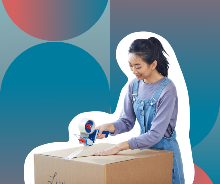 person taping up a large moving box