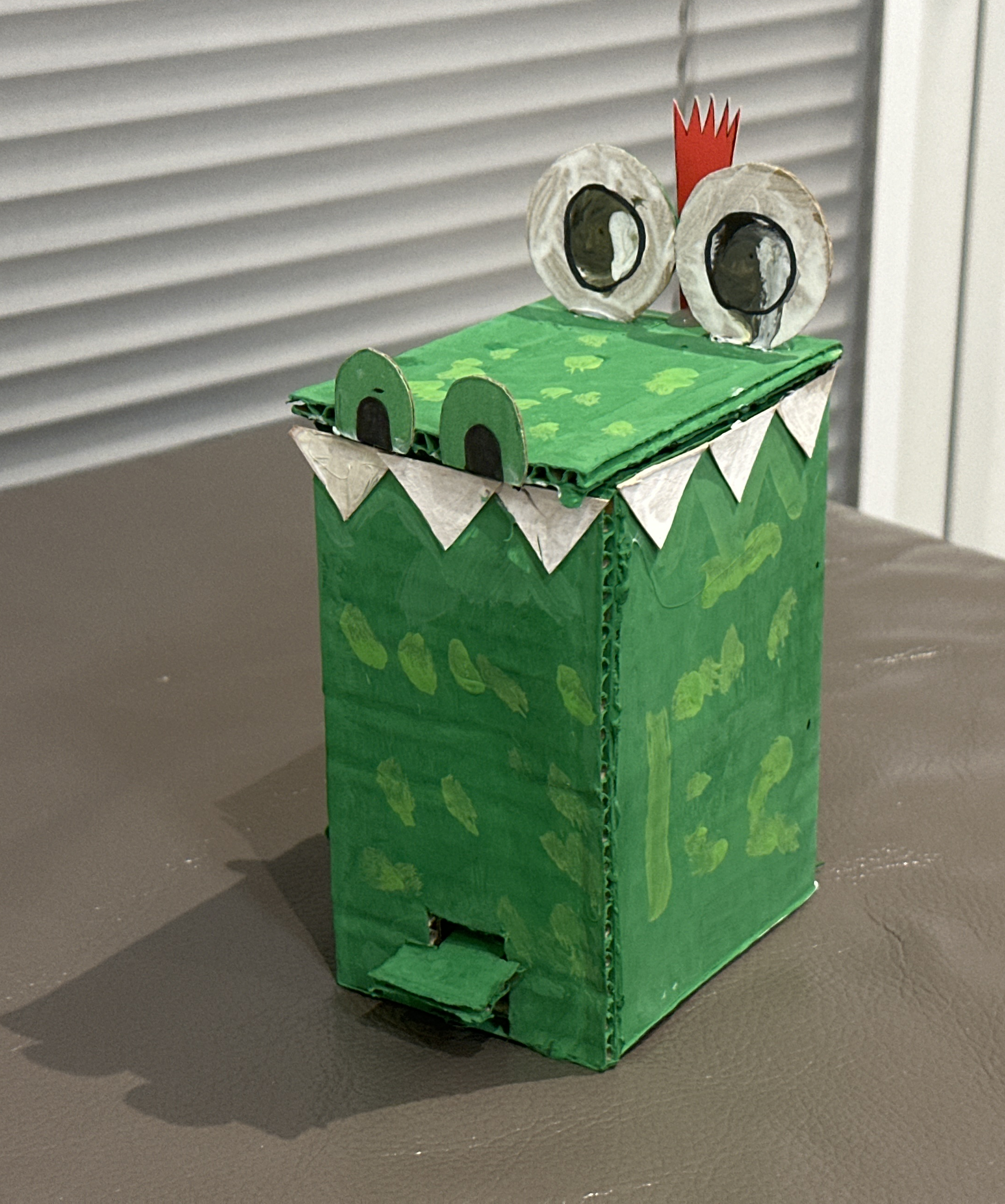 I have made a waste bin with a pedal, when you push on the pedal the bin opens just like a real bin. I have designed my waste bin as a crocodile.