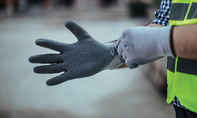 Man wearing saftey gloves