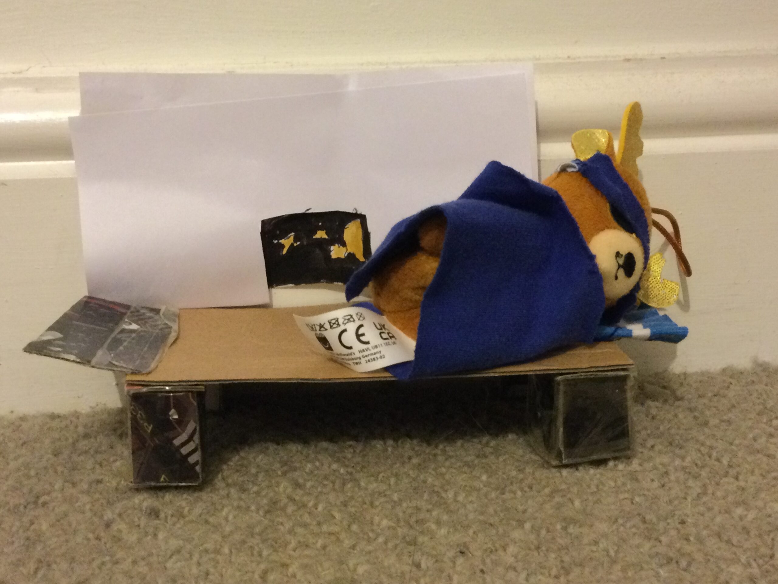 Animal sleeping in a bed I made scaled