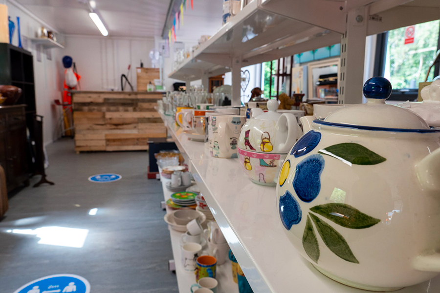 Shelf full of pottery